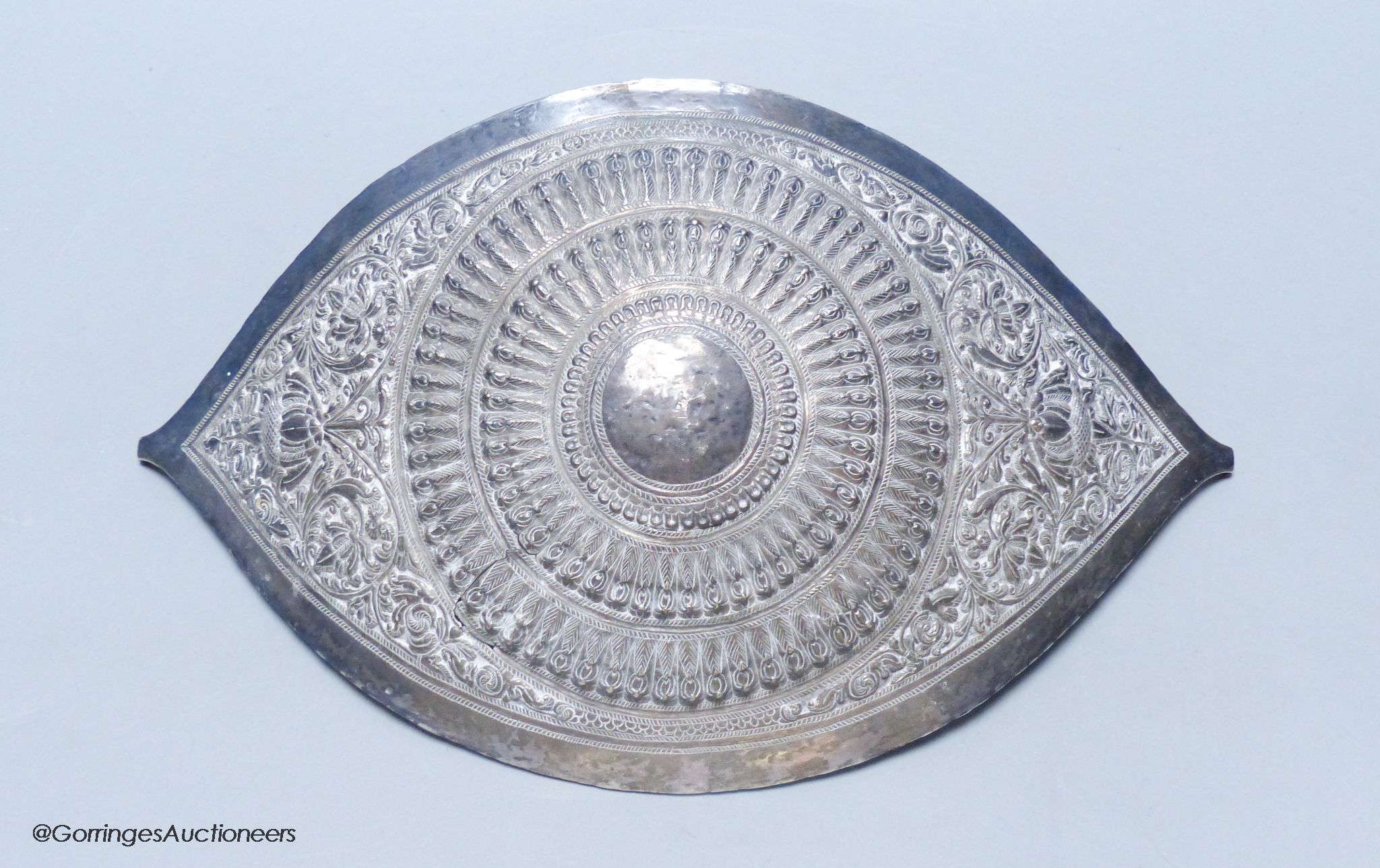 A Chinese Straits large white metal belt buckle, of curved navette form, L 28cm